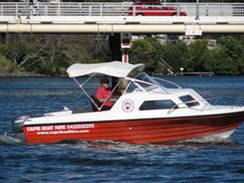 Cruising the Nerang River in a half cabin hire boat