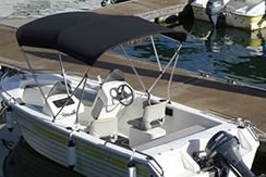 Bow rider boat for hire shown sitting at dock in Surfers Paradise