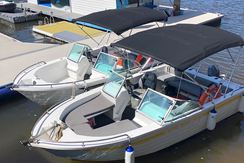 Two 8 person bowrider hire boats side by side